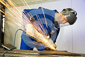 Construction worker with angle grinder