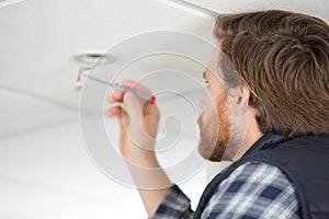 construction worker assemble suspended ceiling