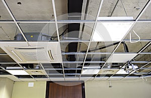 Construction worker assemble a suspended ceiling