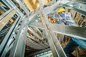 Construction Worker Attaching Metal Frame Elements