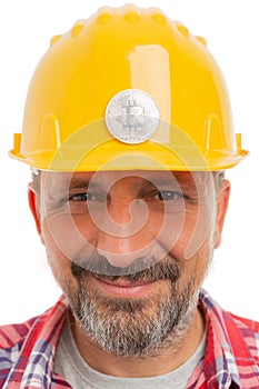 Construction worker with bitcoin on helmet