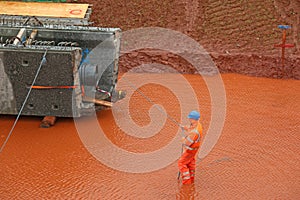 Construction worker with a bridge beam