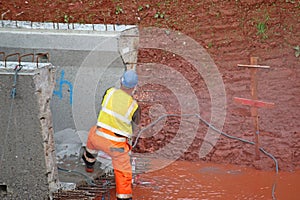 Construction worker with a bridge beam