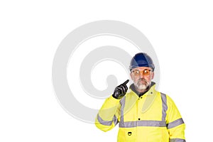 construction worker in a bright yellow hi-viz coat and safety gloves wearing tinted safety glasses for eye protection isolated