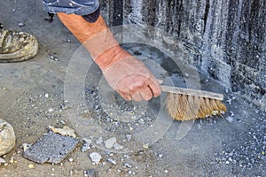 Construction Worker with broom sweeping concrete 3