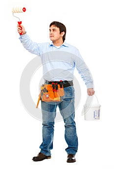 Construction worker with bucket and brush painting