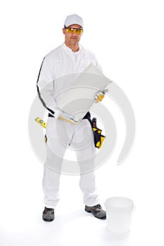 Construction worker with bucket and tile adhesive