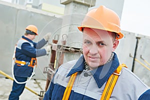 Construction worker. Builders concreter joiners at work