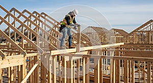 Construction Worker Building Wooden House Frame