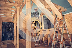 Construction Worker Building Wooden House Frame