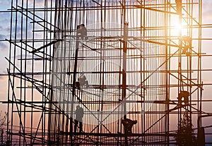 Construction worker bundling steel structure