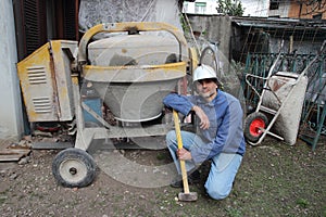 Construction worker with cement mixer