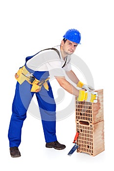 Construction worker with ceramic bricks