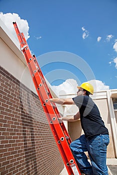 Construction Worker Climbs to Roof