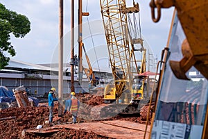 Construction worker Concrete pouring during commercial concreting floors of building in construction site and Civil Engineer or