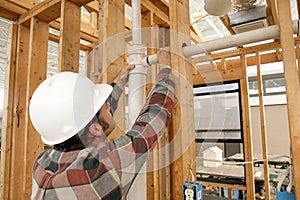 Construction Worker Connecting Pipe