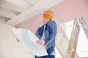 Construction worker consulting on his mobile phone