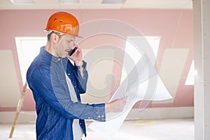 Construction worker consulting with somebody