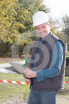 Construction Worker Contractor Man using tablet laptop computer