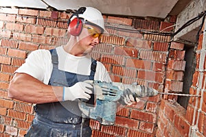 Construction worker with drill perforator