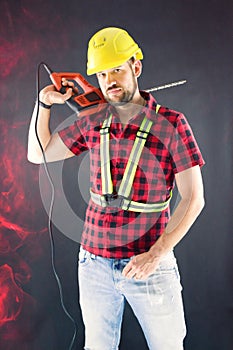 Construction Worker with drilling and demolition hammer