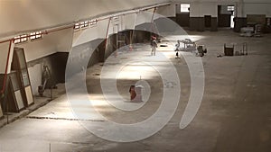 Construction Worker In An Empty Wharehouse