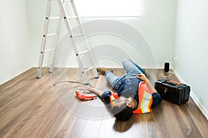 Hispanic electrician having a work accident