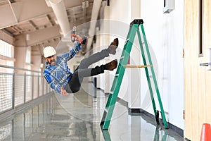 Construction worker falling off the ladder