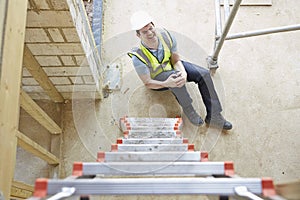 Construction Worker Falling Off Ladder And Injuring Leg