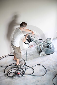 Concrete grinding in family home,construction works photo