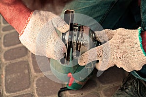 Construction worker fixing the pavestone