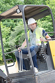 Construction worker with forklift truck