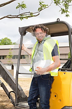 Construction worker with forklift truck