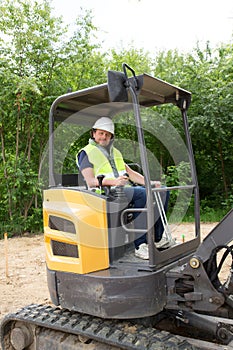 Construction worker with forklift truck