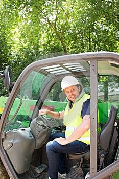 Construction worker with forklift truck