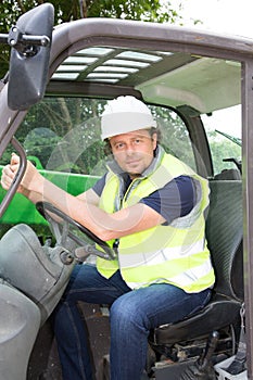 Construction worker with forklift truck
