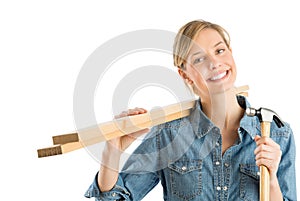 Construction Worker With Hammer Carrying Wooden Planks On Should