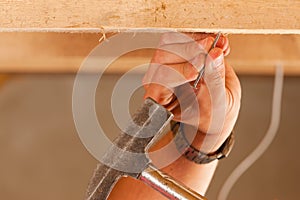 Construction worker with hammer and nail