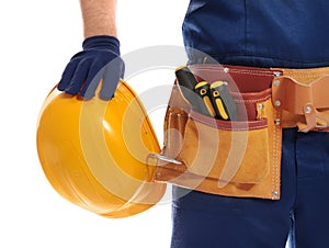 Construction worker with hard hat and tool belt on white