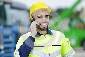 Construction worker having conversation on phone