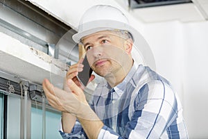 Construction worker having serious phone conversation