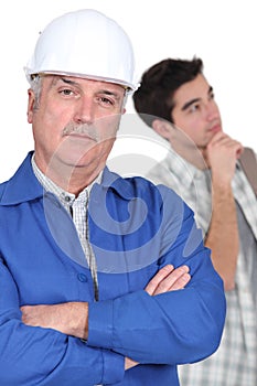 Construction worker and his trainee.