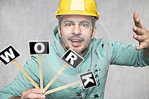 Construction worker holding a blackboard with space for text or text, copy space