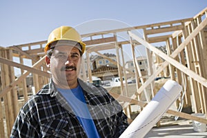 Construction Worker Holding Blueprint