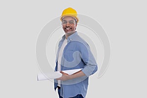 Construction Worker Holding House Plan in Hands. Architect Holding Blueprints. Yellow Hard Helmet