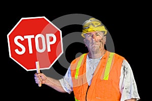 Construction worker holding stop sign