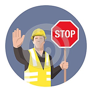 Construction worker holding STOP sign in his hand