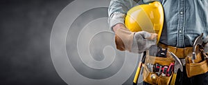The construction worker holding a yellow hard hat in a professional setting. AI generated image