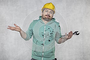 The construction worker holds the key in his hands, the key as a source of inspiration and ingenuity