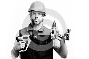 Construction worker holds yellow building tools. Finished work